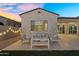 Enjoy this home's backyard with landscape lighting and an outdoor seating area at 4360 S Atom --, Mesa, AZ 85212