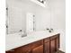Bathroom with a large mirror over the vanity with a sink and cabinet at 4360 S Atom --, Mesa, AZ 85212