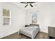 Cozy bedroom featuring neutral-toned walls, wood-look flooring and a comfortably sized bed at 4360 S Atom --, Mesa, AZ 85212