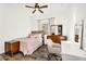Bedroom featuring neutral-toned walls, wood-look flooring and a writing desk at 4360 S Atom --, Mesa, AZ 85212