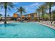 Large community pool with abundant lounge seating and a view of the clubhouse at 4360 S Atom --, Mesa, AZ 85212