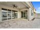 This covered patio boasts travertine floors and large sliding glass doors for seamless indoor/outdoor living at 4360 S Atom --, Mesa, AZ 85212