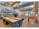 This is a stylish game room with fun activities, tables and vintage school bus at 4360 S Atom --, Mesa, AZ 85212