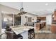 Open concept kitchen features a center island, stainless steel appliances, and sliding glass doors to outdoor space at 4360 S Atom --, Mesa, AZ 85212