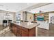 Open-concept kitchen featuring a granite island and seamless flow into the living area at 4360 S Atom --, Mesa, AZ 85212
