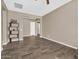 Open living room has tile floors, neutral colors, and versatile layout at 4360 S Atom --, Mesa, AZ 85212