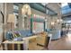 Stylish lounge area with vibrant blue sofas, eclectic decor, and plenty of seating for relaxation and socializing at 4360 S Atom --, Mesa, AZ 85212