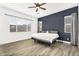 Relaxing main bedroom with neutral decor, a ceiling fan, and lots of natural light at 4360 S Atom --, Mesa, AZ 85212