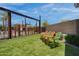 This is a serene outdoor area with lounge chairs and turf at 4360 S Atom --, Mesa, AZ 85212