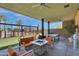 Inviting outdoor patio features comfortable seating, a fire pit, and lush landscaping at 4360 S Atom --, Mesa, AZ 85212