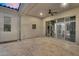 Covered patio featuring travertine tile, sliding glass doors, and views of the home's interior at 4360 S Atom --, Mesa, AZ 85212