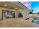 Back patio with a ceiling fan, sliding doors to the living room and kitchen, and an inviting pool at 4360 S Atom --, Mesa, AZ 85212