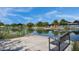 Scenic view of community pond and park area with benches, offering a serene and relaxing atmosphere at 4360 S Atom --, Mesa, AZ 85212