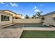 Beautiful backyard pool with travertine deck, privacy wall, and desert landscaping at 4360 S Atom --, Mesa, AZ 85212