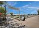 Charming view of the Steadfast Farm at Eastmark, featuring a white picket fence and agricultural fields at 4360 S Atom --, Mesa, AZ 85212