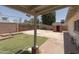 The backyard features a grass area, a concrete patio, a shed, and a woodpile at 4515 N 35Th St, Phoenix, AZ 85018