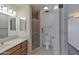 Bathroom with vanity, tiled floors, and a glass-enclosed shower at 4515 N 35Th St, Phoenix, AZ 85018