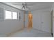Bedroom with ceiling fan, large window, and closet space at 4515 N 35Th St, Phoenix, AZ 85018