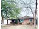 Charming single-story brick home features mature trees, a well-manicured lawn, and inviting curb appeal at 4515 N 35Th St, Phoenix, AZ 85018