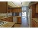 Efficient kitchen has lovely wood cabinets, granite countertops, and a view into the backyard at 4515 N 35Th St, Phoenix, AZ 85018