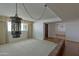 Spacious living room with large windows, neutral carpet, and unique hanging light fixture at 4515 N 35Th St, Phoenix, AZ 85018