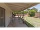 Covered patio with seating overlooks the backyard and includes access to the house at 4515 N 35Th St, Phoenix, AZ 85018