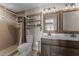 Bathroom featuring double sinks, a tiled shower, and rustic accents at 4602 W Monte Cristo Ave, Glendale, AZ 85306