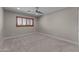 Bright bedroom features a modern ceiling fan and a window with wooden shutters at 4602 W Monte Cristo Ave, Glendale, AZ 85306