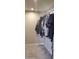 Features a neutral color palette and clothes hanging on a bar at 4602 W Monte Cristo Ave, Glendale, AZ 85306