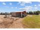 Well-maintained horse stable with individual stalls, fencing, and ample outdoor space, perfect for equestrian enthusiasts at 4602 W Monte Cristo Ave, Glendale, AZ 85306