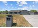 Charming single-story home featuring a large front yard, gray painted brick, and a two car garage at 4602 W Monte Cristo Ave, Glendale, AZ 85306