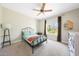 Inviting bedroom with a ceiling fan, a comfy bed, and natural light from a large window at 5335 E Shea Blvd # 1087, Scottsdale, AZ 85254