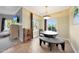 Charming dining area with modern lighting, a round table, bench seating, and a view of the outdoors at 5335 E Shea Blvd # 1087, Scottsdale, AZ 85254