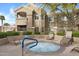 Inviting community hot tub surrounded by lush landscaping and comfortable lounge chairs at 5335 E Shea Blvd # 1087, Scottsdale, AZ 85254