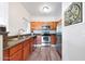 Well-lit kitchen featuring stainless steel appliances, granite countertops, and wood-look floors at 5335 E Shea Blvd # 1087, Scottsdale, AZ 85254