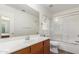 Bathroom with a large mirror and a shower with a glass door at 5401 W Jessica Ln, Laveen, AZ 85339
