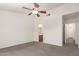A Primary bedroom featuring an open bathroom and hallway at 5401 W Jessica Ln, Laveen, AZ 85339