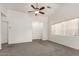 Spacious living room with neutral carpet, vaulted ceiling, and plenty of natural light at 5401 W Jessica Ln, Laveen, AZ 85339