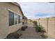 Lush backyard featuring a covered patio, landscape, and a privacy fence, enhancing outdoor enjoyment at 5616 W Hidalgo Ave, Laveen, AZ 85339