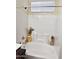 Bathtub with white subway tile, and decorative accents, offering a relaxing ambiance at 5616 W Hidalgo Ave, Laveen, AZ 85339