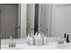 Bathroom with double sinks, ample countertop space, and well-lit vanity mirrors at 5616 W Hidalgo Ave, Laveen, AZ 85339
