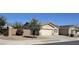 Charming single-story home with a two-car garage, desert landscaping, and a welcoming entrance at 5616 W Hidalgo Ave, Laveen, AZ 85339