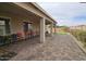 Covered patio featuring stylish brick pavers and plenty of space for outdoor seating and entertaining at 5616 W Hidalgo Ave, Laveen, AZ 85339