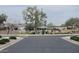 Community street view of a lush, landscaped park with mature trees, and a gazebo at 5616 W Hidalgo Ave, Laveen, AZ 85339