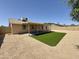 Backyard with covered patio and artificial turf near home at 6419 W Monte Cristo Ave, Glendale, AZ 85306
