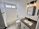 Bright bathroom with modern vanity, mirror, and fixtures, plus updated bath and shower at 6419 W Monte Cristo Ave, Glendale, AZ 85306