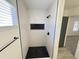 Modern tiled shower featuring a black shower head, niche, and eye-catching black honeycomb flooring at 6419 W Monte Cristo Ave, Glendale, AZ 85306