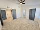 Spacious bedroom with new carpet, walk-in closet and gray accent doors at 6419 W Monte Cristo Ave, Glendale, AZ 85306