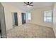 Bedroom featuring new carpet, gray accent doors and a ceiling fan at 6419 W Monte Cristo Ave, Glendale, AZ 85306