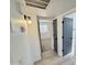 Hallway with updated light fixture and doors leading to bedrooms at 6419 W Monte Cristo Ave, Glendale, AZ 85306